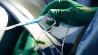 An interventional cardiologist operates on a patient